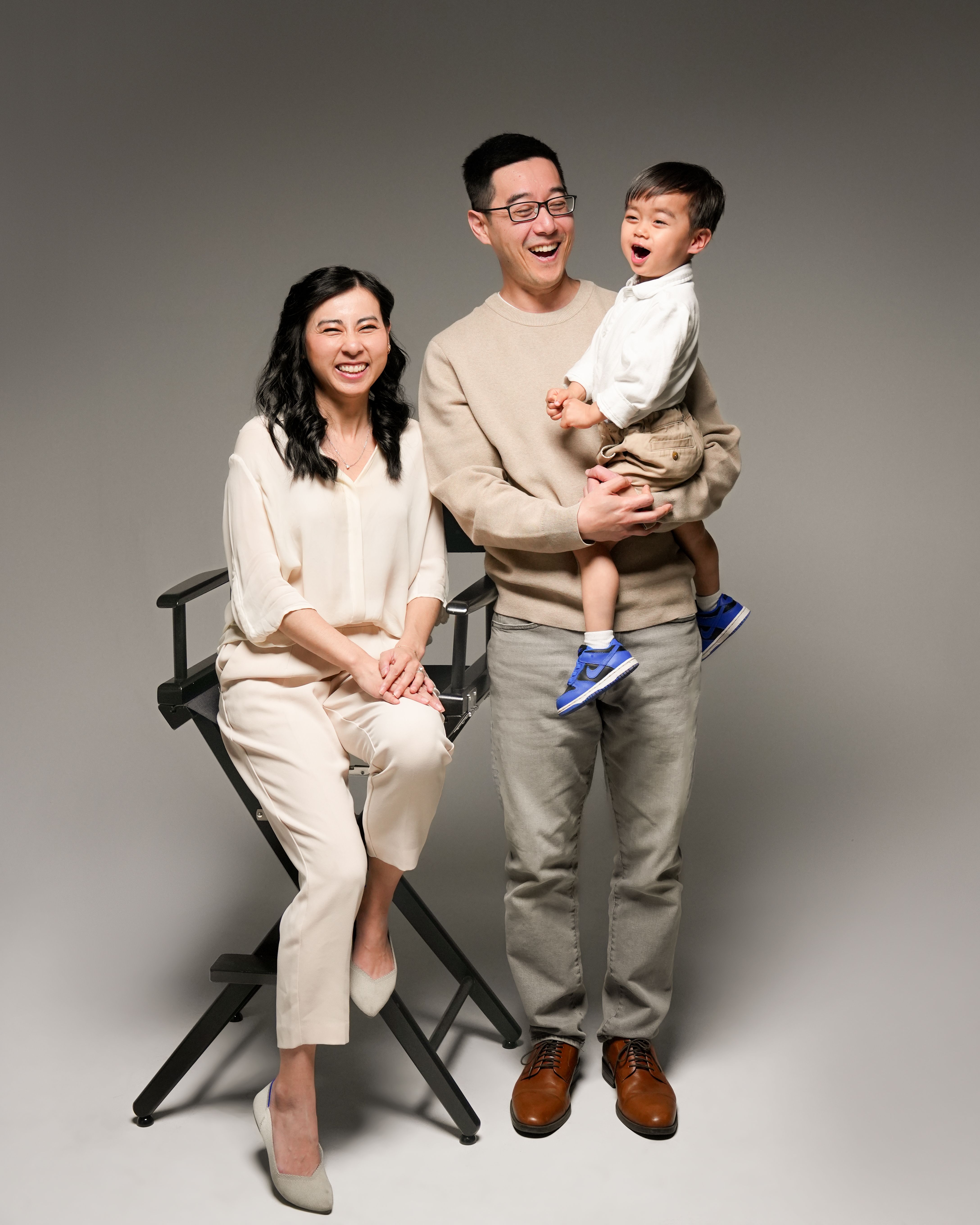 Parents holding their toddler during a studio family portrait in Santa Clara, California