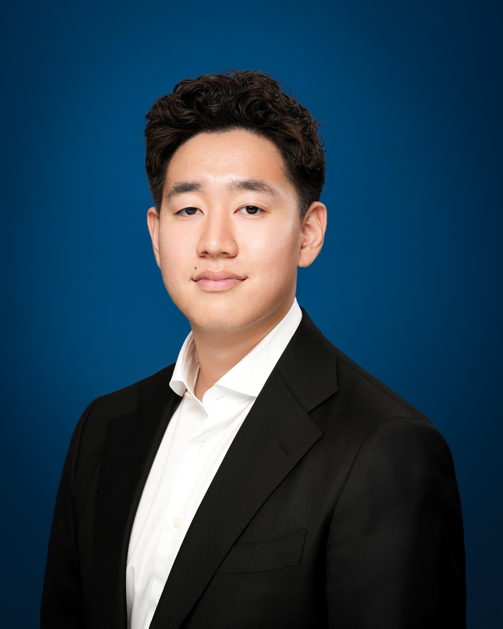 Professional headshot wardrobe for men with a blazer and clean neckline