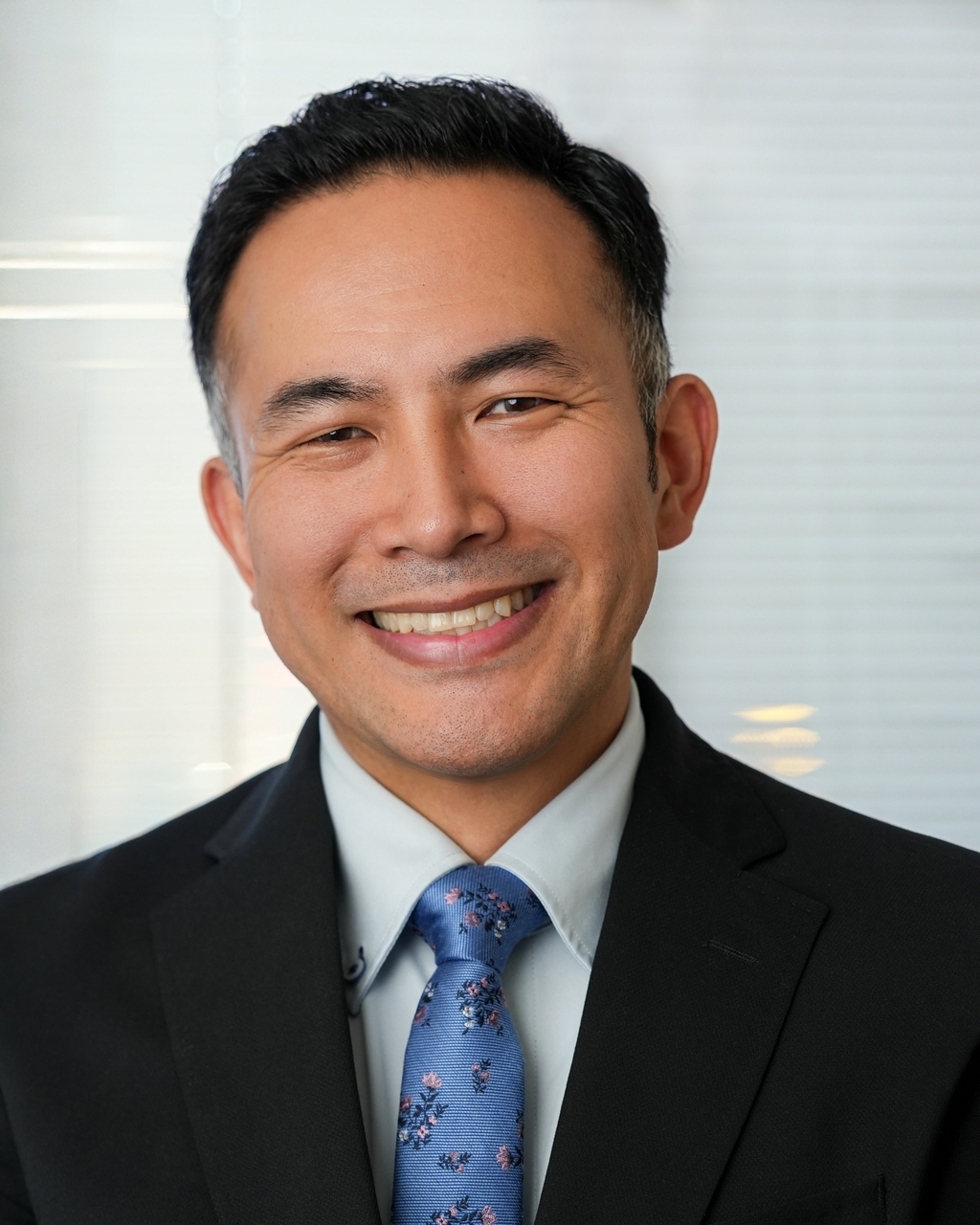 Man grooming facial hair before a professional headshot session