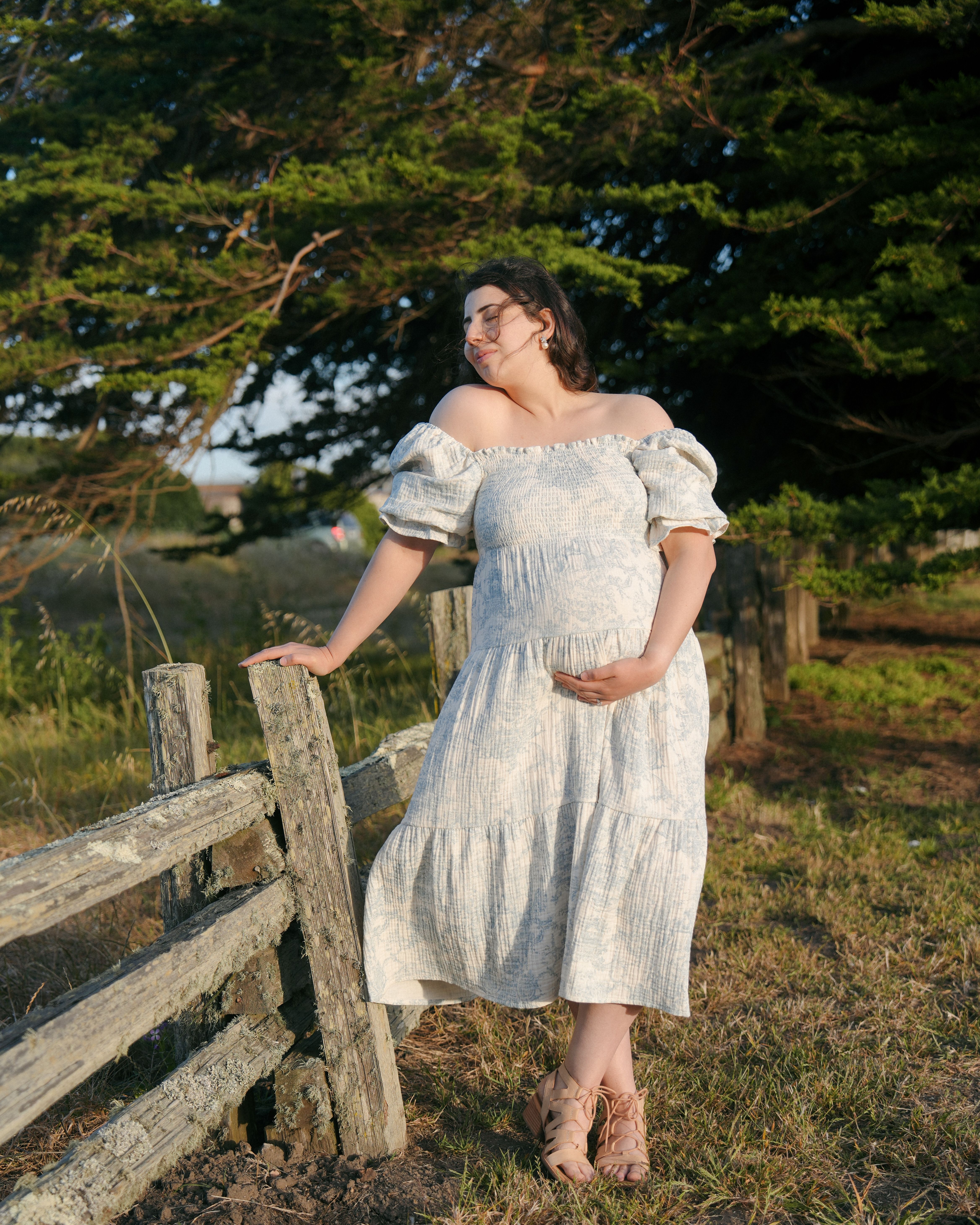 Maternity couple embracing near the dunes in Tiburon, California