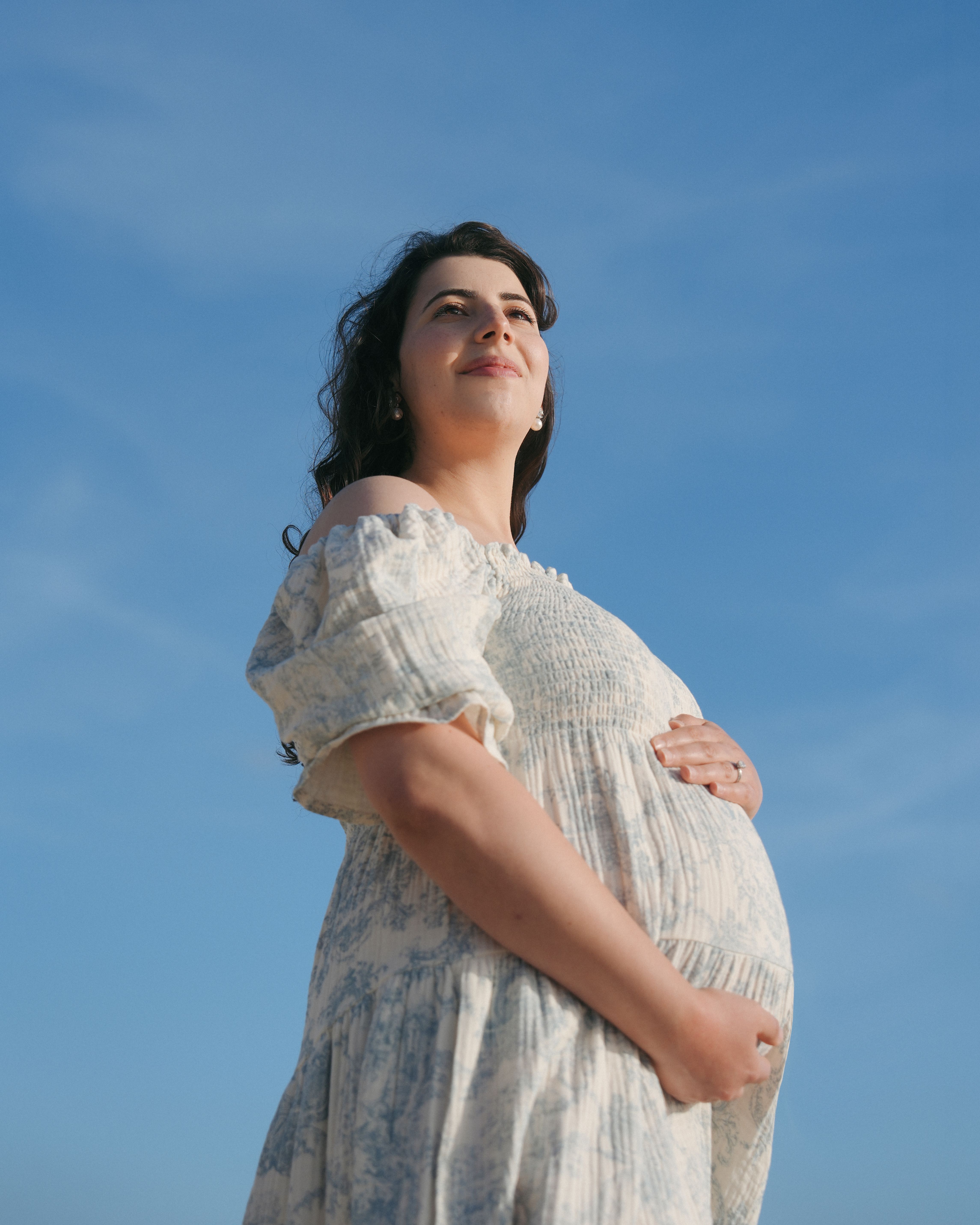 Close maternity portrait by the shoreline in Marin Headlands, California
