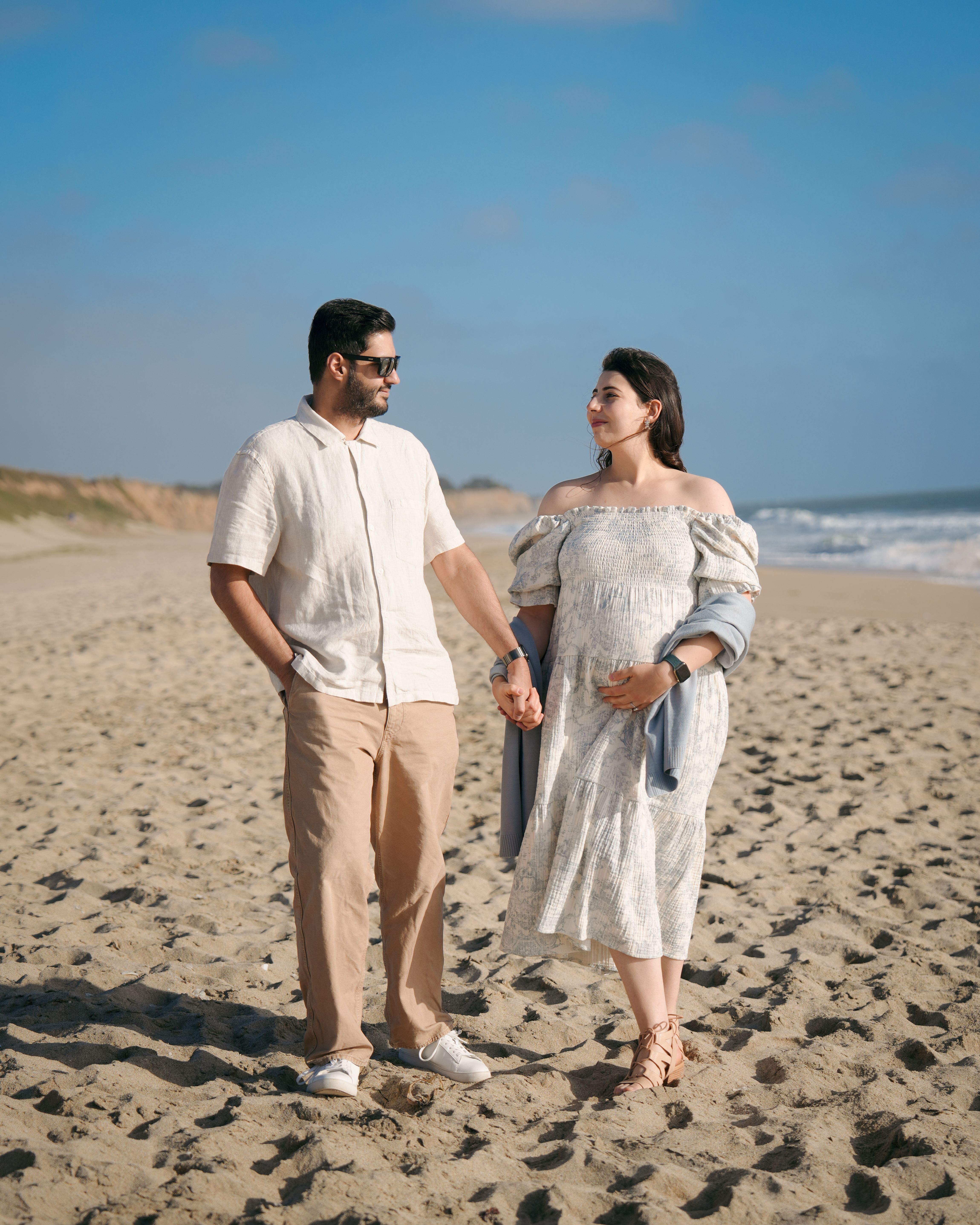 Close maternity belly embrace in Pescadero, California
