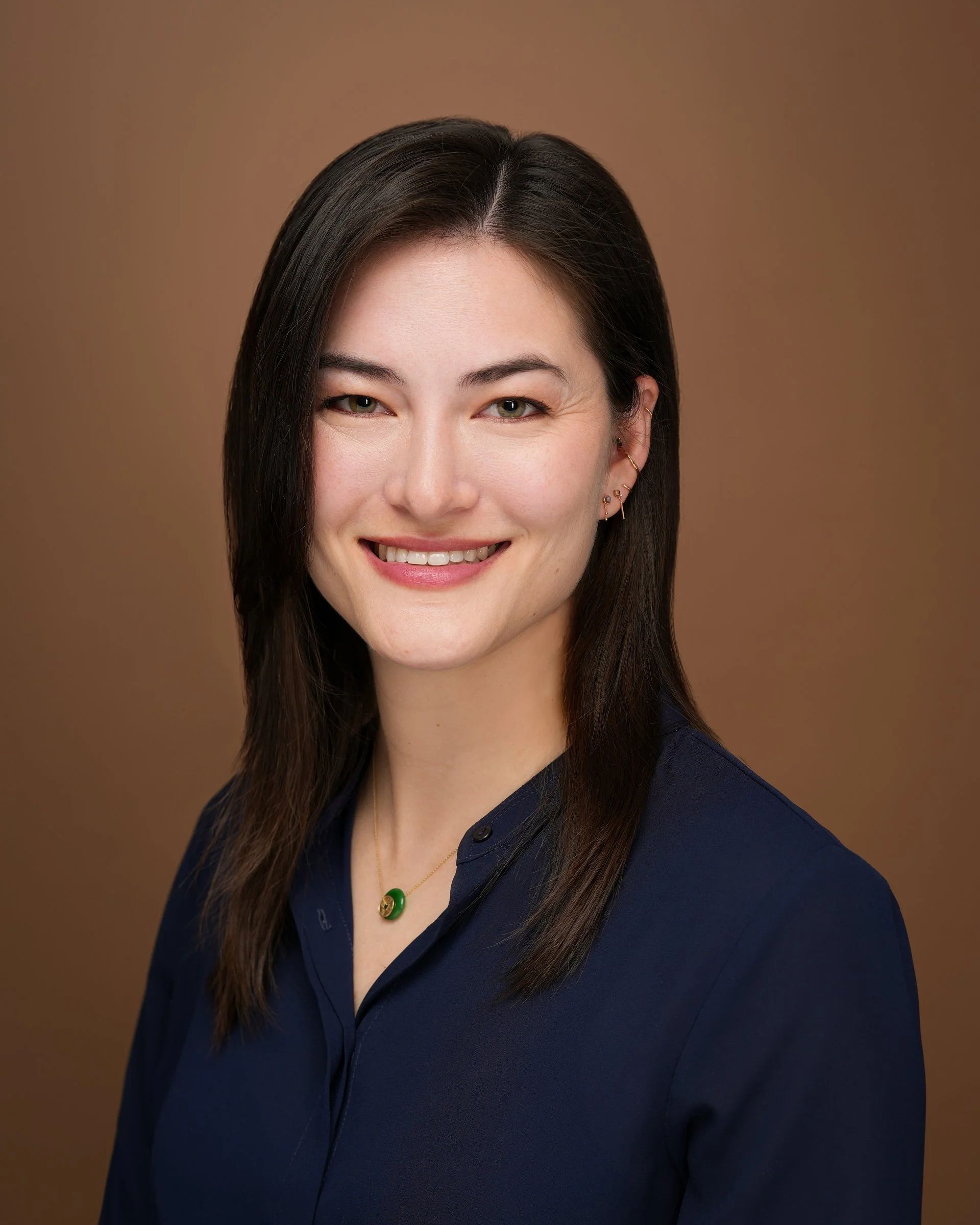 Professional women’s headshot at the Stanford Main Quad in Palo Alto, California.